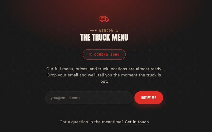 Truck Menu page in its pre-launch state: a coming-soon badge, a short message, and an email field with a Notify me button over a faint ogee pattern